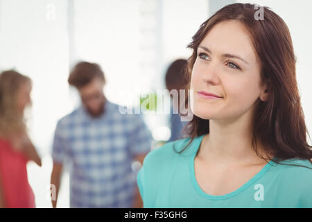 Thoughtful woman making face Stock Photo