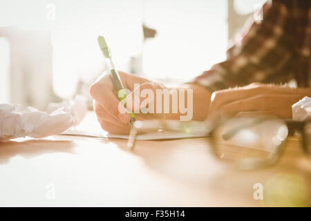 Cropped image of businessman writing on paper Stock Photo
