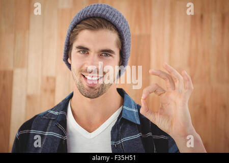 Portrait of happy hipster showing OK sign Stock Photo