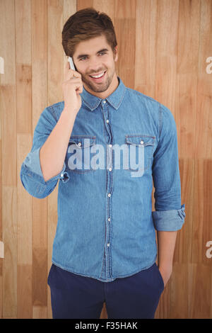 Happy hipster using mobile phone Stock Photo