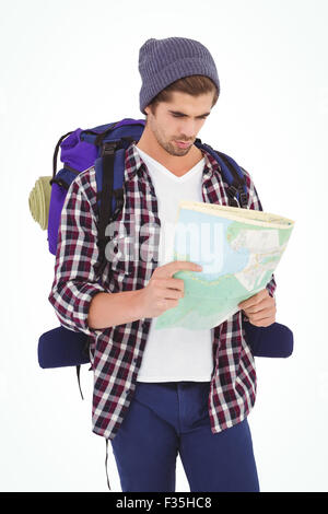 Man with backpack looking in map Stock Photo