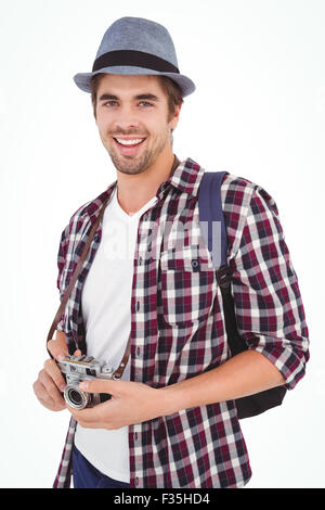 Portrait of man smiling while holding camera Stock Photo