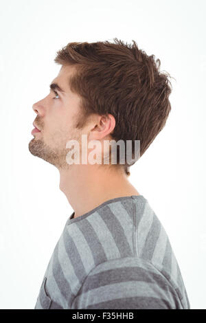 Side view of serious man looking up Stock Photo