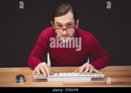 Creative businessman working at computer desk Stock Photo