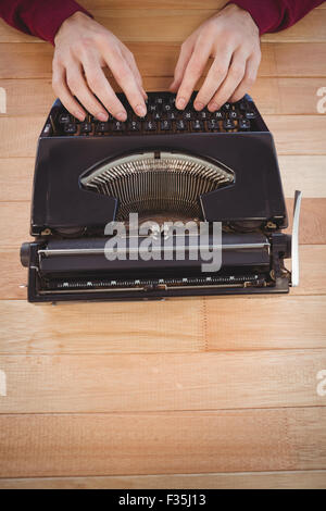 High angle view of man using typewriter Stock Photo