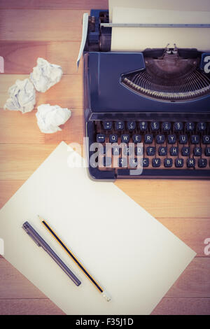 Typewriter and paper on table Stock Photo
