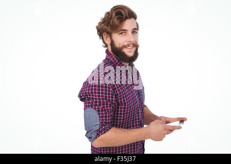 Portrait of confident hipster using smartphone Stock Photo