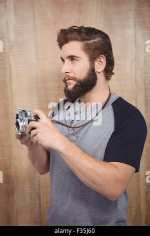 Hipster using digital camera Stock Photo