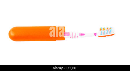toothbrush in the open orange box isolated on white background Stock Photo