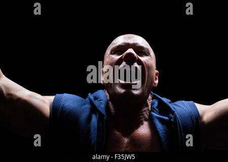 Excited muscular man shouting Stock Photo