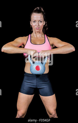 Portrait of confident woman exercising at gym Stock Photo - Alamy