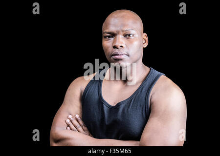 Portrait of bald bodybuilder with arms crossed Stock Photo