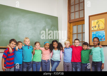 Students standing in line in classroom Stock Photo - Alamy