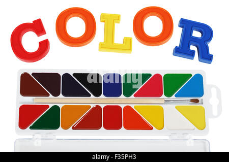 Plastic letters and watercolor paints isolated on white background Stock Photo