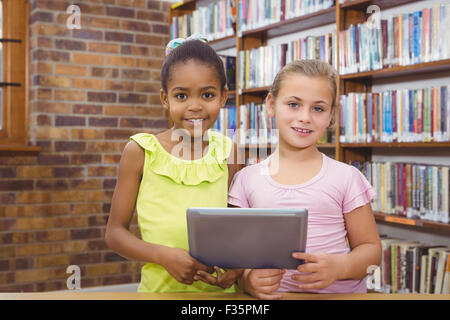Students using a tablet pc together Stock Photo