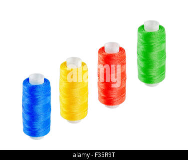 Four multi-colored skeins of thread isolated on white background Stock Photo