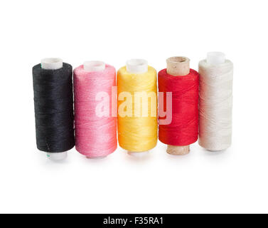 five skeins of yarn standing in a row isolated on white background Stock Photo