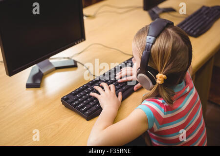 Cute pupil in computer class Stock Photo