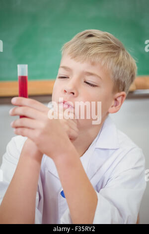 Student using a microscope and chemistry set Stock Photo