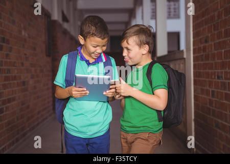 Students using a tablet and smart phone Stock Photo