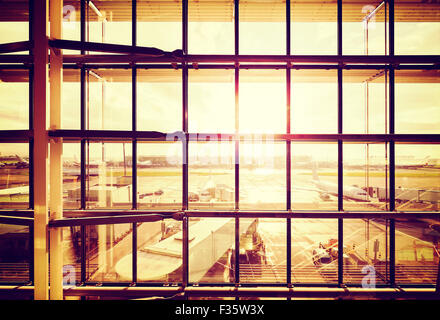 Vintage filtered picture of an airport, transportation and business travel concept. Stock Photo