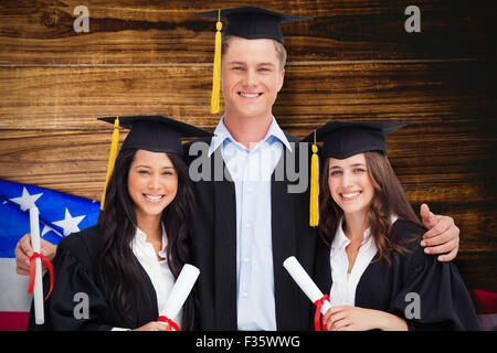 Composite image of three friends graduate from college together Stock Photo