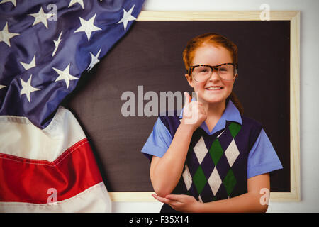 Composite image of cute pupil dressed up as teacher Stock Photo