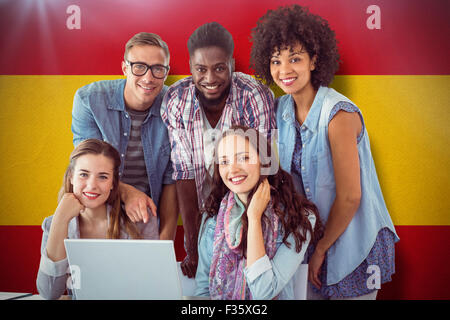 Composite image of fashion students working as a team Stock Photo