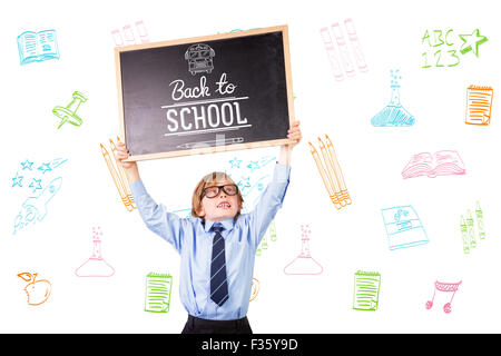 Composite image of cute pupil holding chalkboard Stock Photo