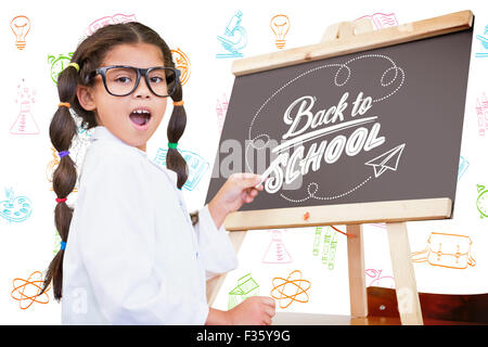 Composite image of cute pupil with chalkboard Stock Photo