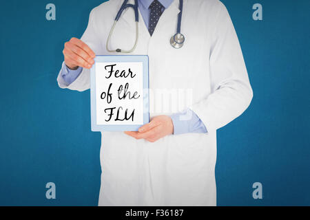 Composite image of doctor showing a digital tablet Stock Photo