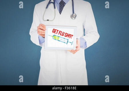 Composite image of doctor showing digital tablet on white background Stock Photo