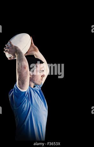 Composite image of disappointed rugby player holding his head Stock Photo