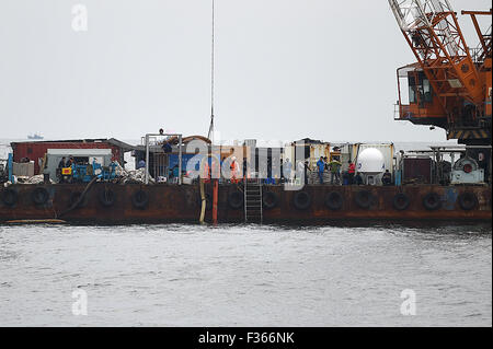 Dandong, China's Liaoning Province. 30th Sep, 2015. A working staff ...