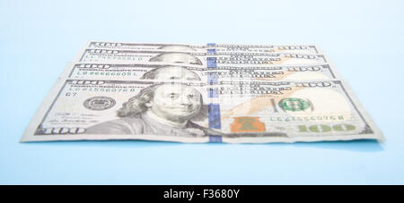 Four hundred dollar notes. All on blue background Stock Photo