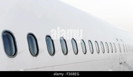 Passenger aircraft windows. View from outside. Stock Photo