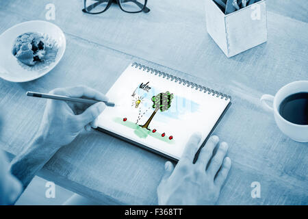 Composite image of man writing notes on notebook Stock Photo