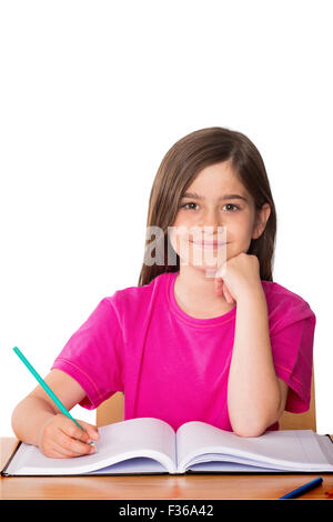 Composite image of cute pupil working at her desk Stock Photo - Alamy