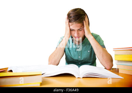 Student sitting in library reading Stock Photo