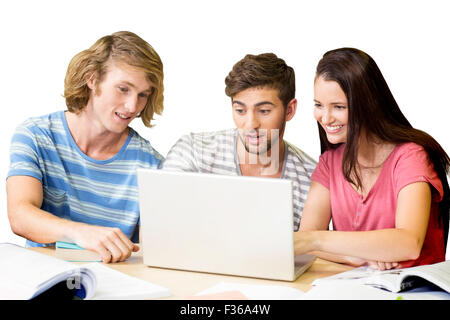 College students using laptop in library Stock Photo