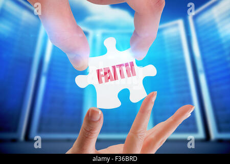 Faith against composite image of server room Stock Photo