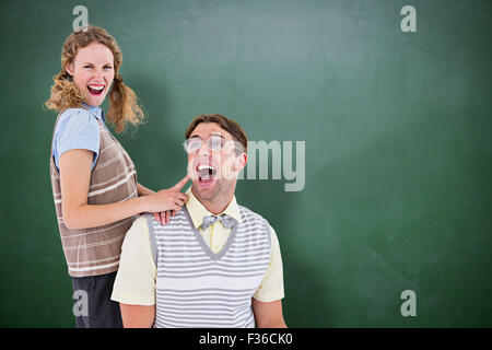 Composite image of excited geeky hipster couple Stock Photo