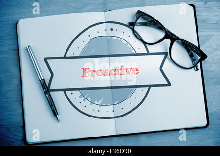 Proactive against overhead of open notebook with pen and glasses Stock Photo