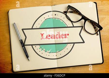 Leader against overhead of open notebook with pen and glasses Stock Photo
