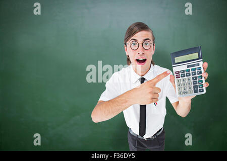 Composite image of geeky cheering businessman holding calculator Stock Photo