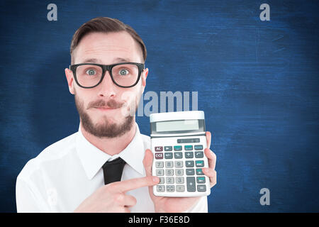 Composite image of geeky businessman pointing to calculator Stock Photo