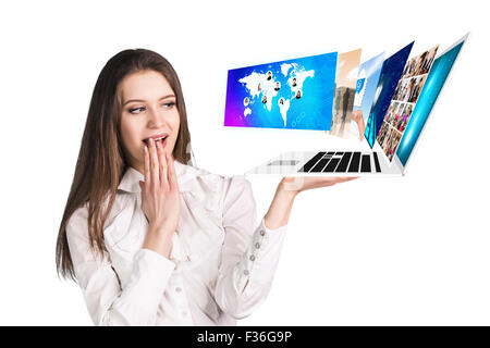 Young woman holds laptop Stock Photo