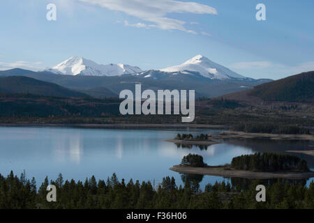 Though the water looks low, the snow on the peaks will increase the tide. Stock Photo
