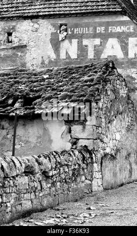 Old stone wall and buildings in black and white Stock Photo