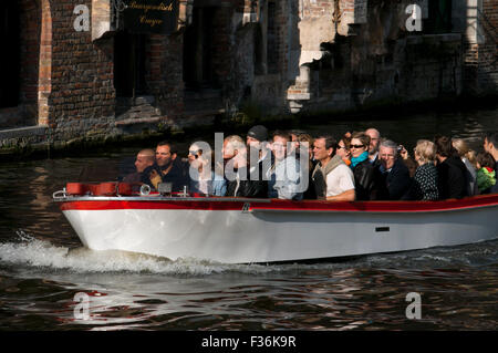 Bruges by boat. One of the best ways to see Bruges is by boat. The half-hour boat trips (with English commentary) mainly operate Stock Photo